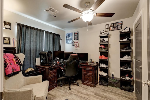 office featuring light wood-type flooring and ceiling fan