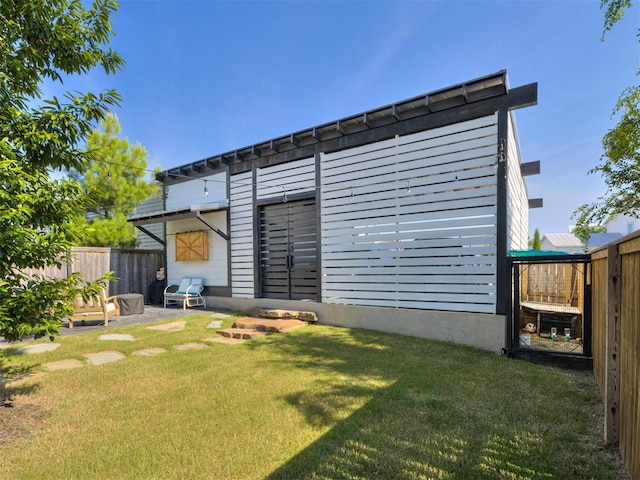 exterior space with a lawn and a patio