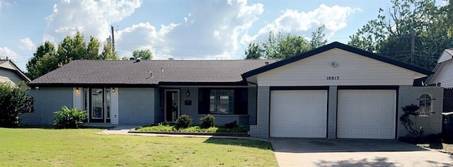 ranch-style house with a front lawn and a garage