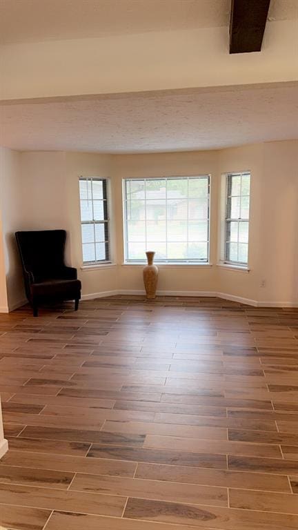 unfurnished room featuring hardwood / wood-style flooring