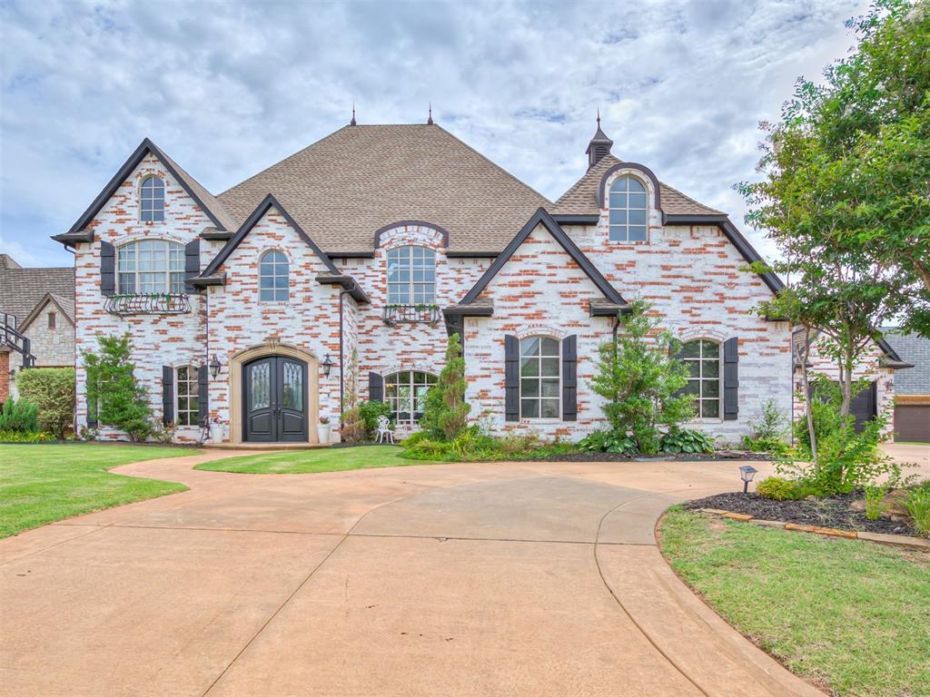 view of front of house featuring french doors and a front lawn