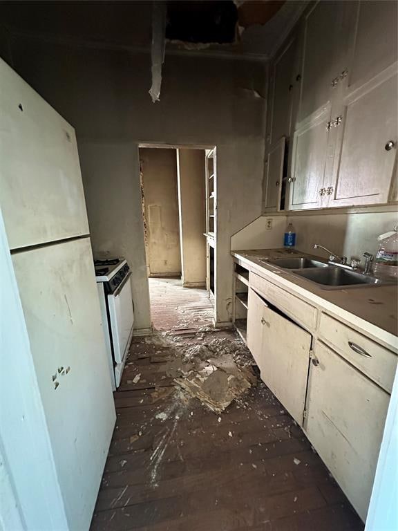 kitchen featuring white appliances and sink