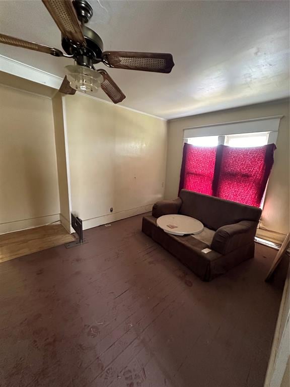 unfurnished room with ceiling fan and wood-type flooring