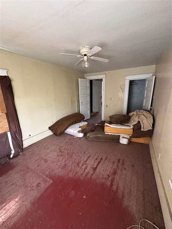 unfurnished bedroom featuring dark hardwood / wood-style flooring and ceiling fan