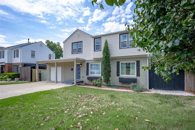 view of front of home with a front yard and a garage