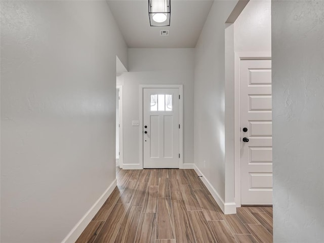 doorway to outside featuring hardwood / wood-style flooring