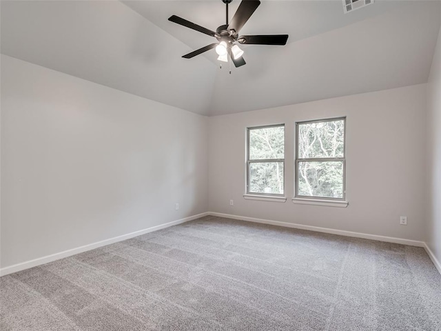 carpeted empty room with ceiling fan and lofted ceiling