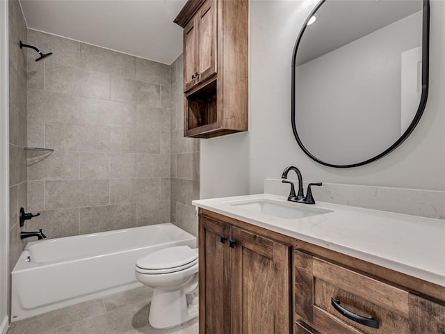 full bathroom featuring tile patterned flooring, vanity, toilet, and tiled shower / bath