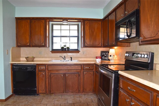 kitchen with sink and black appliances