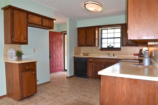 kitchen with dishwasher, decorative backsplash, and sink