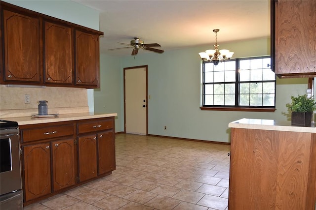 kitchen featuring range with electric stovetop, tasteful backsplash, ceiling fan with notable chandelier, and decorative light fixtures