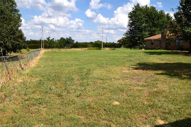 view of yard with a rural view