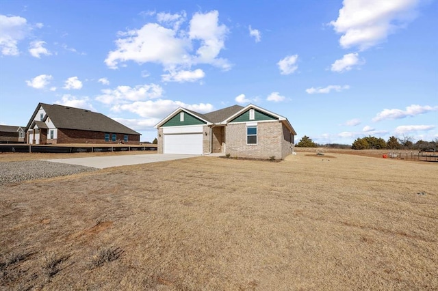 view of front facade with a garage and a front yard