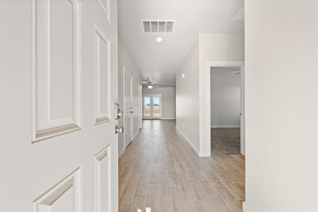 hallway featuring light hardwood / wood-style flooring