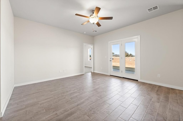 unfurnished room featuring ceiling fan