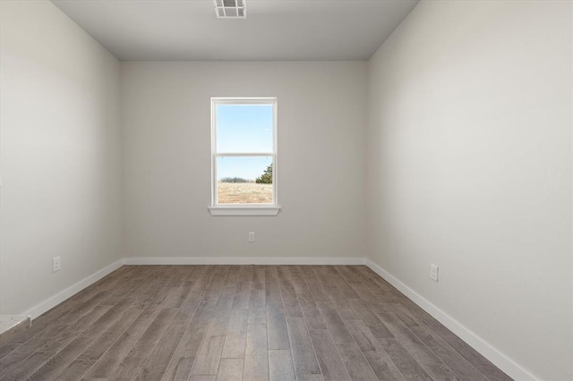 unfurnished room featuring hardwood / wood-style floors