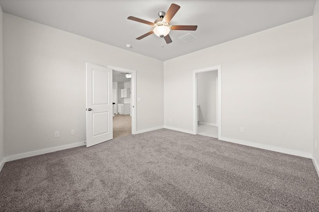 unfurnished room featuring ceiling fan and carpet flooring