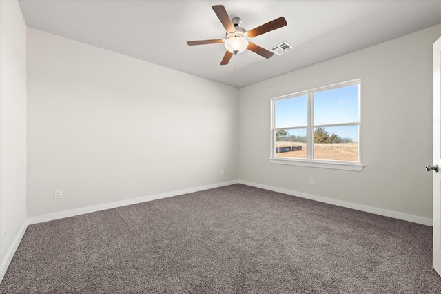 spare room featuring ceiling fan and carpet flooring