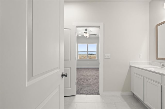 bathroom featuring tile patterned flooring, vanity, and ceiling fan