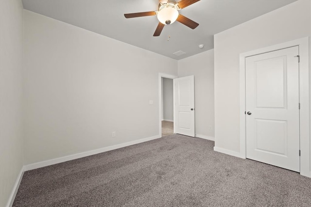 unfurnished bedroom featuring carpet and ceiling fan