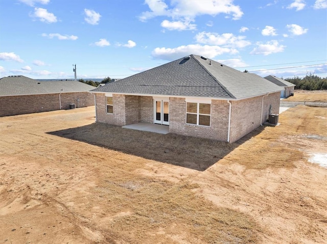 back of house featuring central AC unit and a patio area