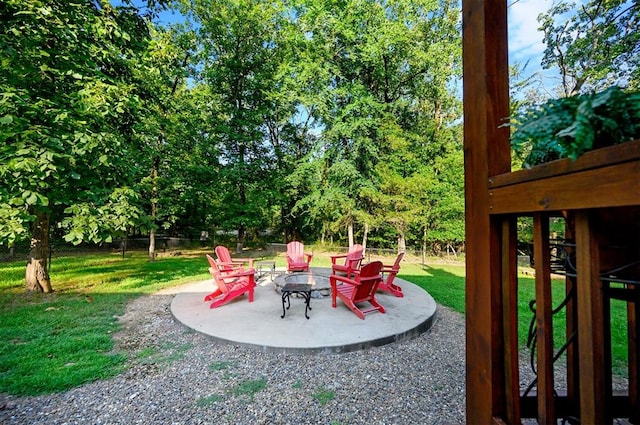 view of yard with a patio and an outdoor fire pit