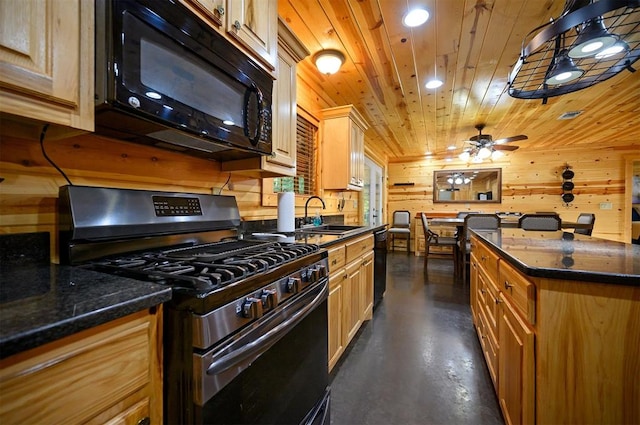 kitchen featuring wood ceiling, ceiling fan, sink, black appliances, and wood walls