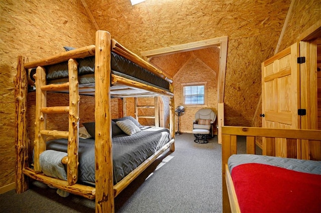 bedroom featuring carpet and vaulted ceiling