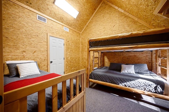 carpeted bedroom featuring lofted ceiling