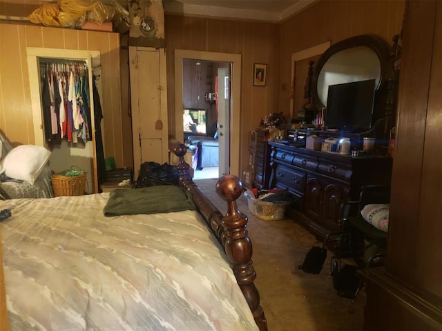 bedroom featuring wooden walls and a closet