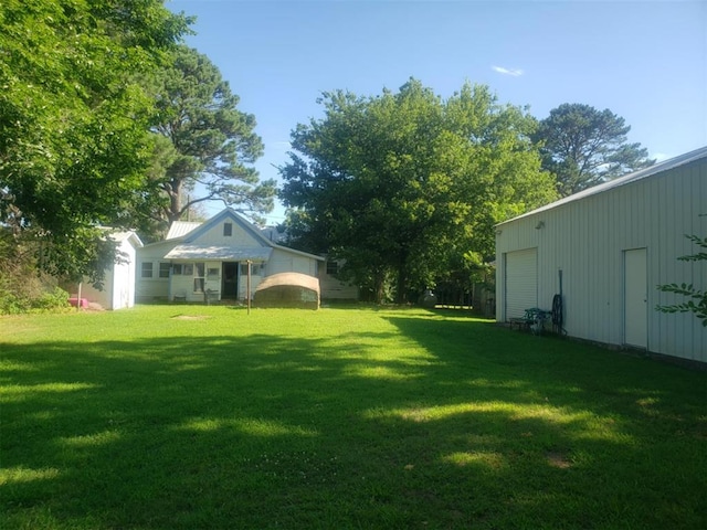 view of yard with a garage