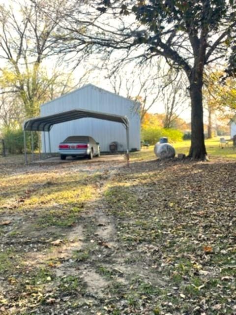 exterior space with a carport