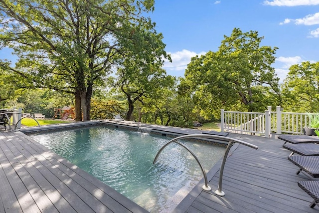 view of swimming pool with a wooden deck