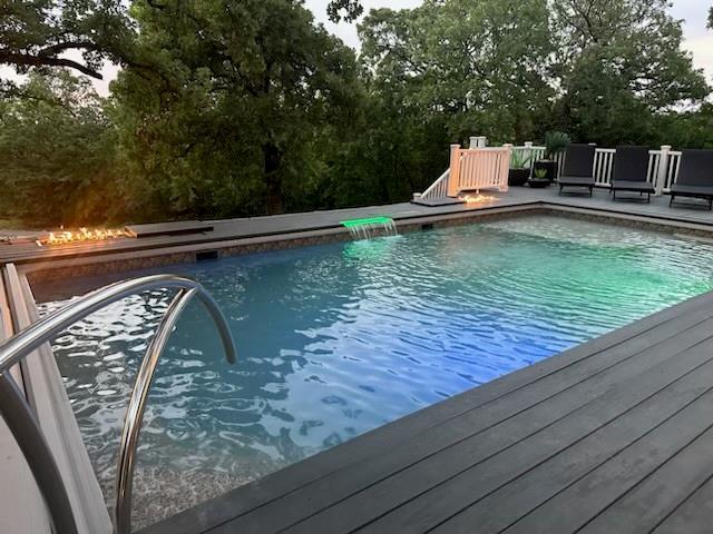 4545 Chickasaw Trl, Sulphur, OK 73086 - outdoor pool featuring view of scattered trees