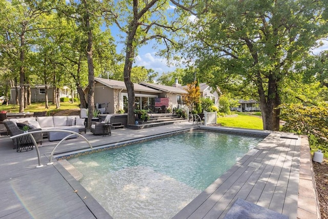 view of swimming pool with an outdoor living space and a patio