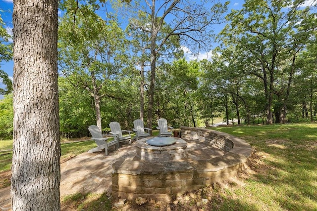 view of patio / terrace featuring an outdoor fire pit