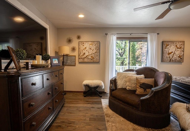 sitting room featuring hardwood / wood-style flooring and ceiling fan