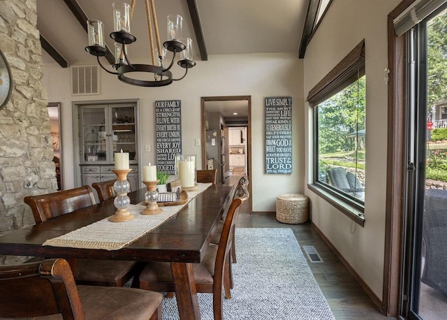 dining room featuring beamed ceiling, dark wood-type flooring, and a chandelier