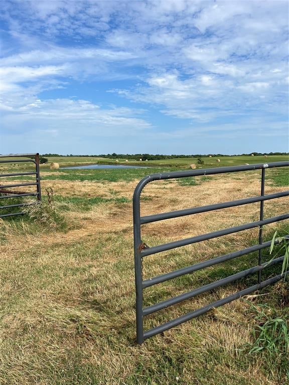 view of gate featuring a rural view