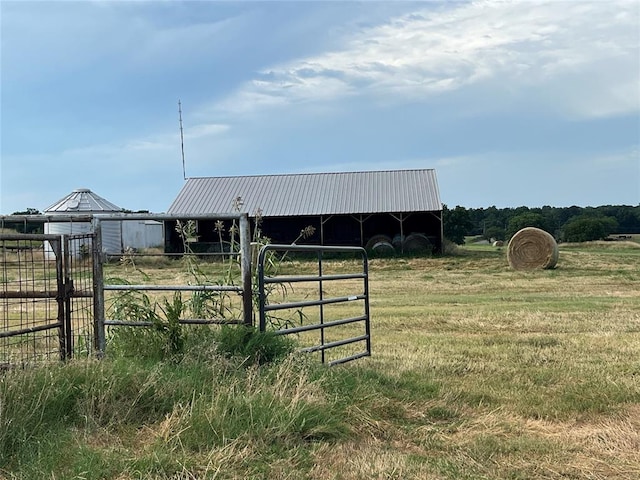 view of outbuilding with a rural view