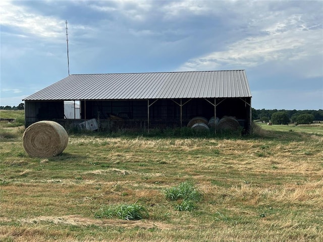 view of outbuilding with a rural view