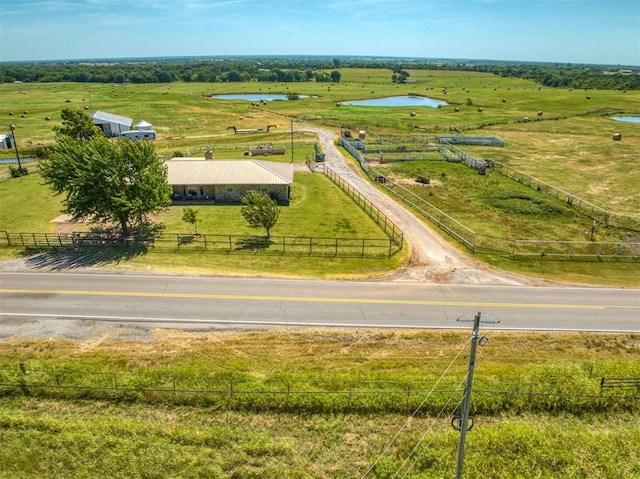 bird's eye view featuring a water view and a rural view