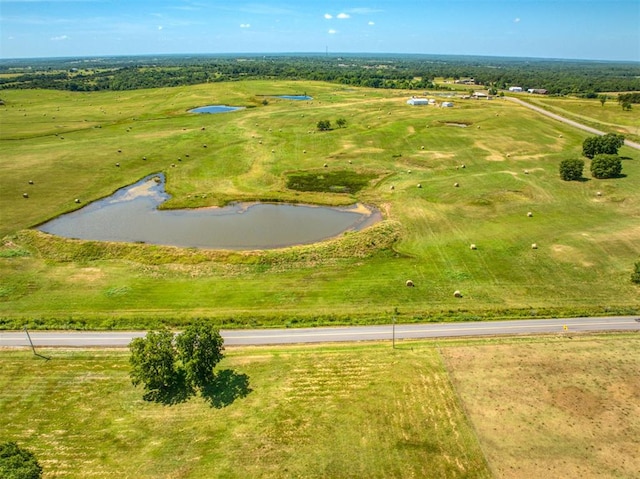 aerial view featuring a rural view and a water view