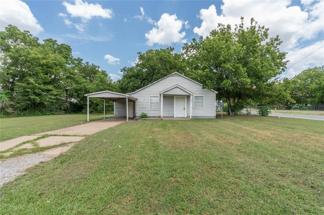 view of outdoor structure featuring a lawn and a carport