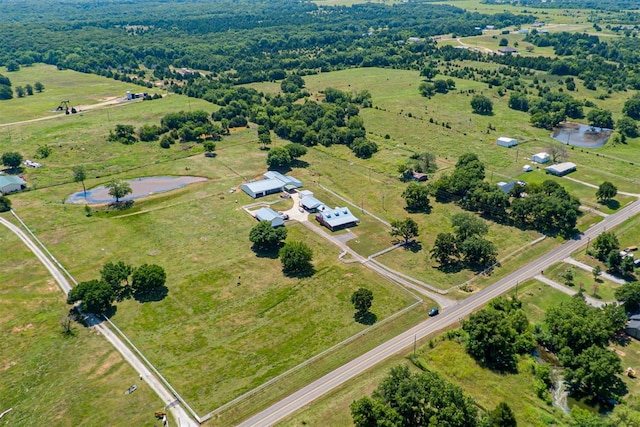 bird's eye view featuring a rural view and a water view