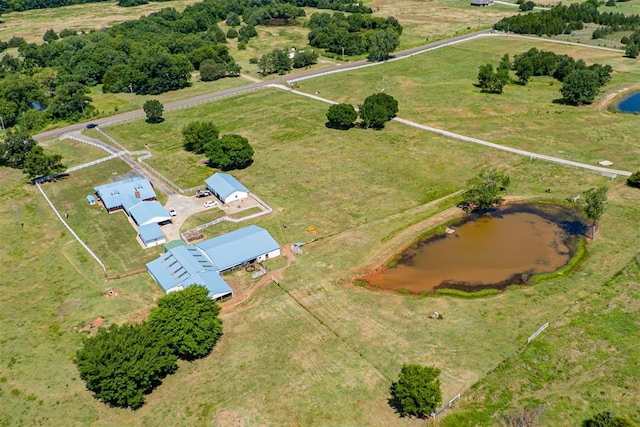 drone / aerial view featuring a rural view and a water view