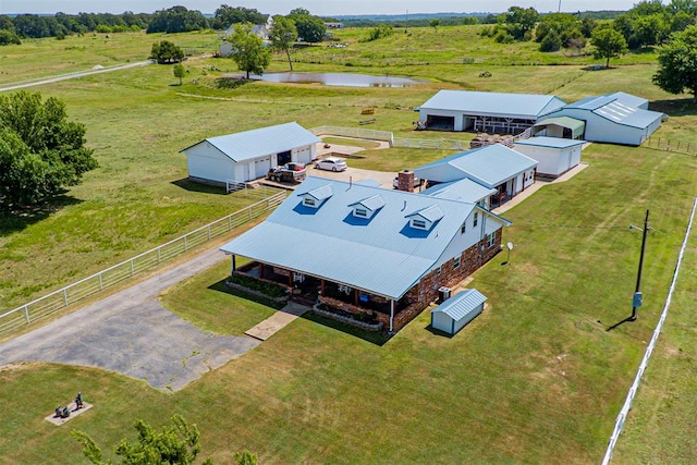 aerial view with a water view and a rural view