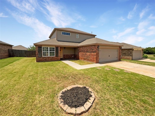 view of front of house with a front yard and a garage