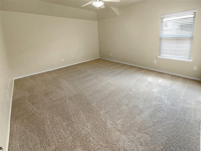 empty room with carpet flooring and ceiling fan