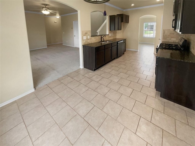 kitchen featuring ceiling fan, dishwasher, sink, tasteful backsplash, and stove